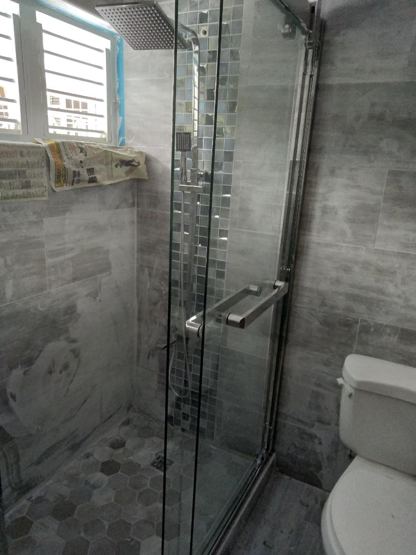 Renovated bathroom with glass shower